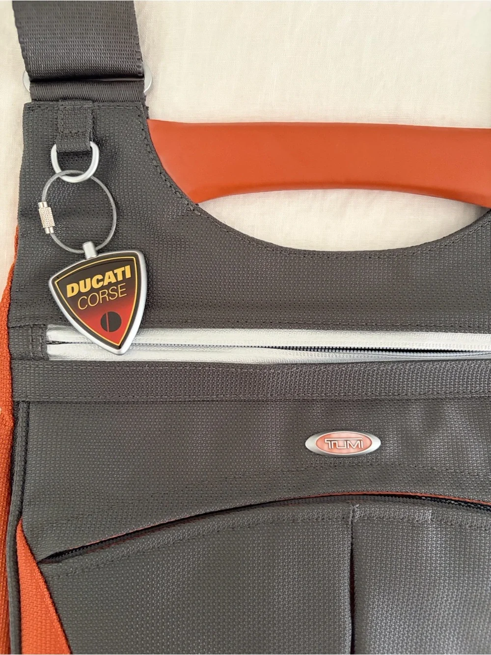 TUMI Ducati Crossbody messenger bag. Discreet corporate logo on back. Never used